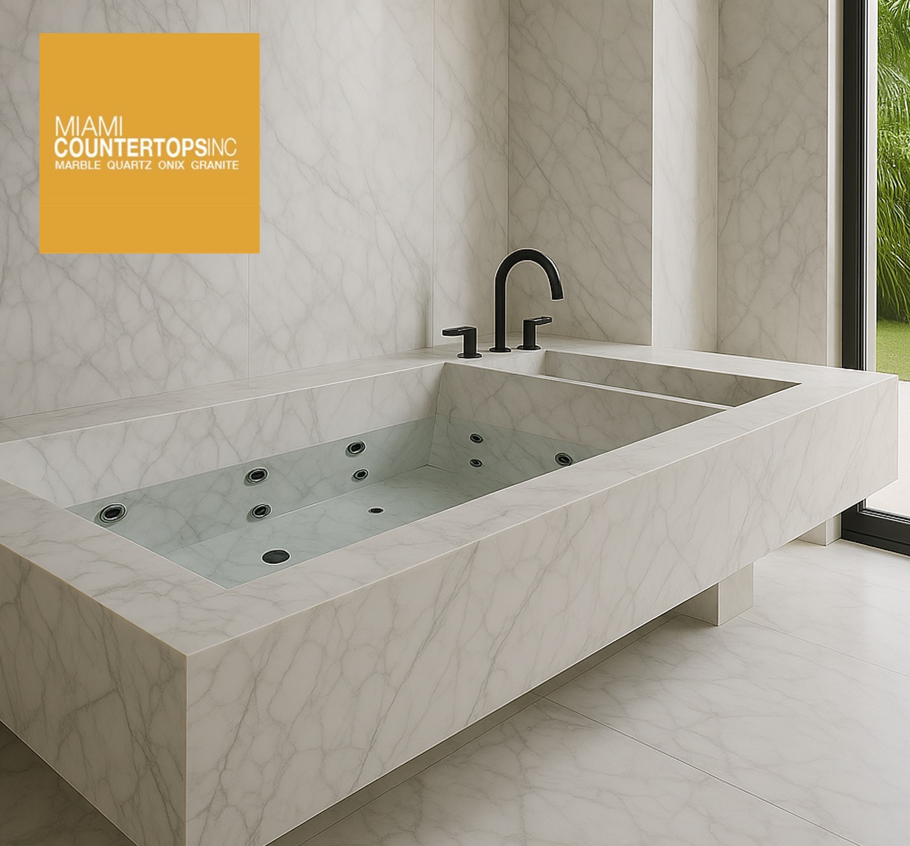 White marble jetted bathtub with gray veining in Miami luxury bathroom by local stone fabricator